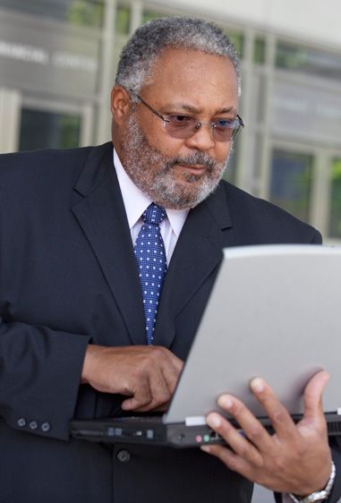 1Businessman_looks_intently_at_his_laptop_1.jpg