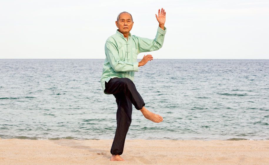 1Senior_Asian_man_practicing_Tai_Chi_on_beach.jpg