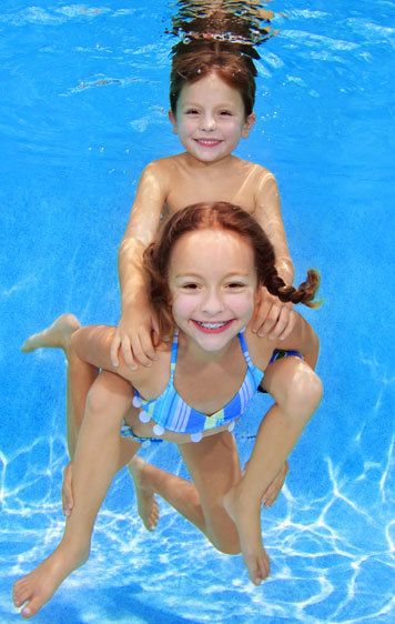 1Sis_gives_brother_piggy_back_ride_underwater.jpg