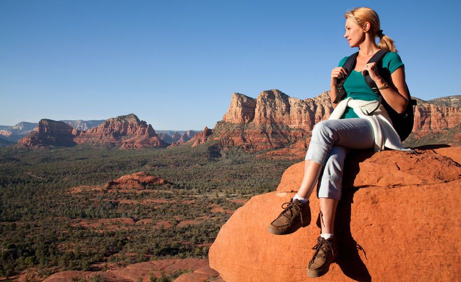 1Woman_hiker_relaxes_on_a_mesa_peak.jpg