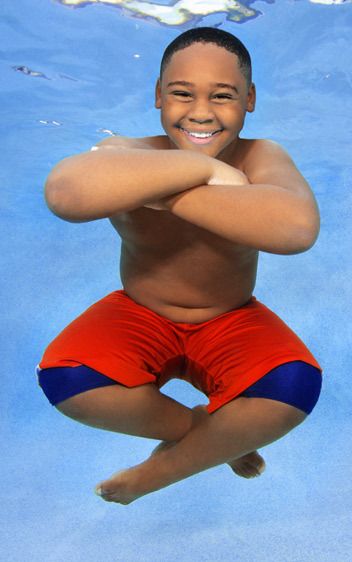 1Smiling_Budha_boy_floating_underwater.jpg