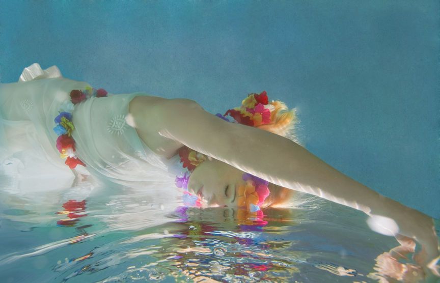 1beautiful_woman_floating_dreamlike_on_water.jpg
