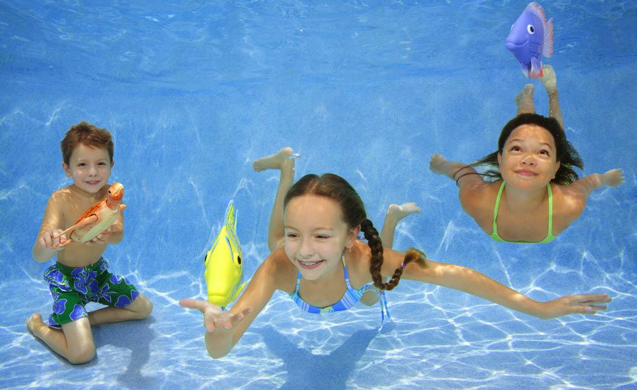 1Three_kids_playing_with_toy_fish_underwater.jpg