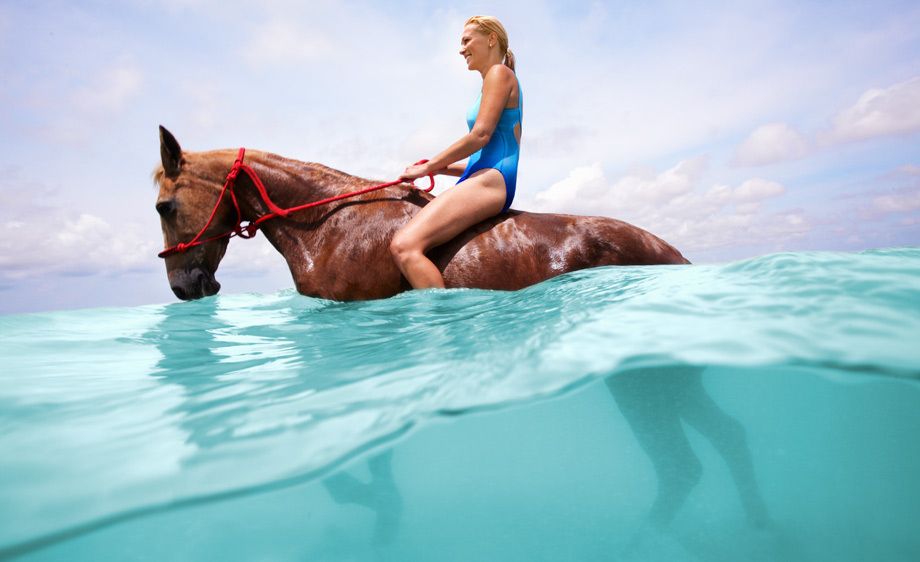 1Girl_in_a_bathing_suit_riding_a_horse_in_water.jpg