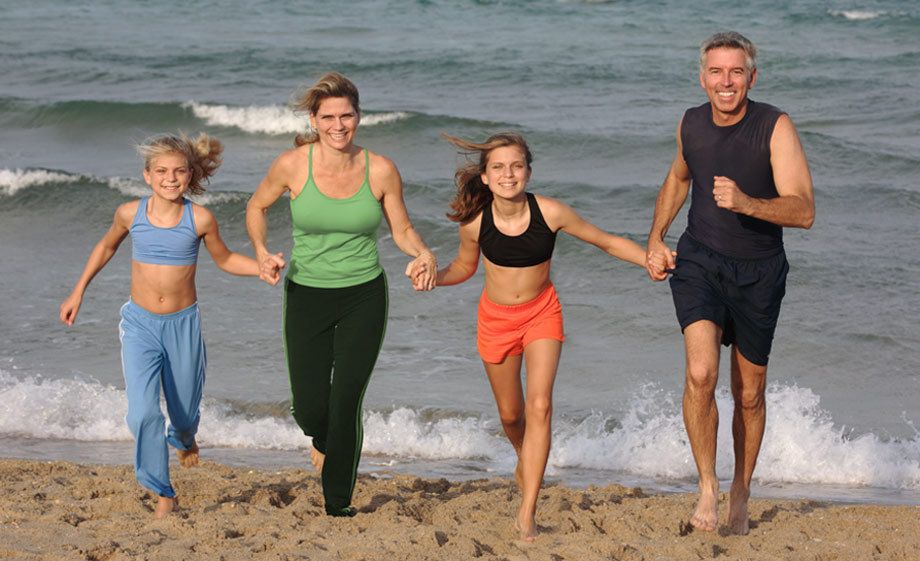 1Family_running_holding_hands_at_the_beach.jpg