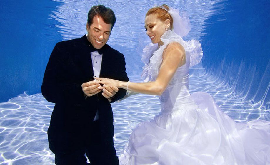 1Bride_and_groom_admire_her_ring_underwater.jpg