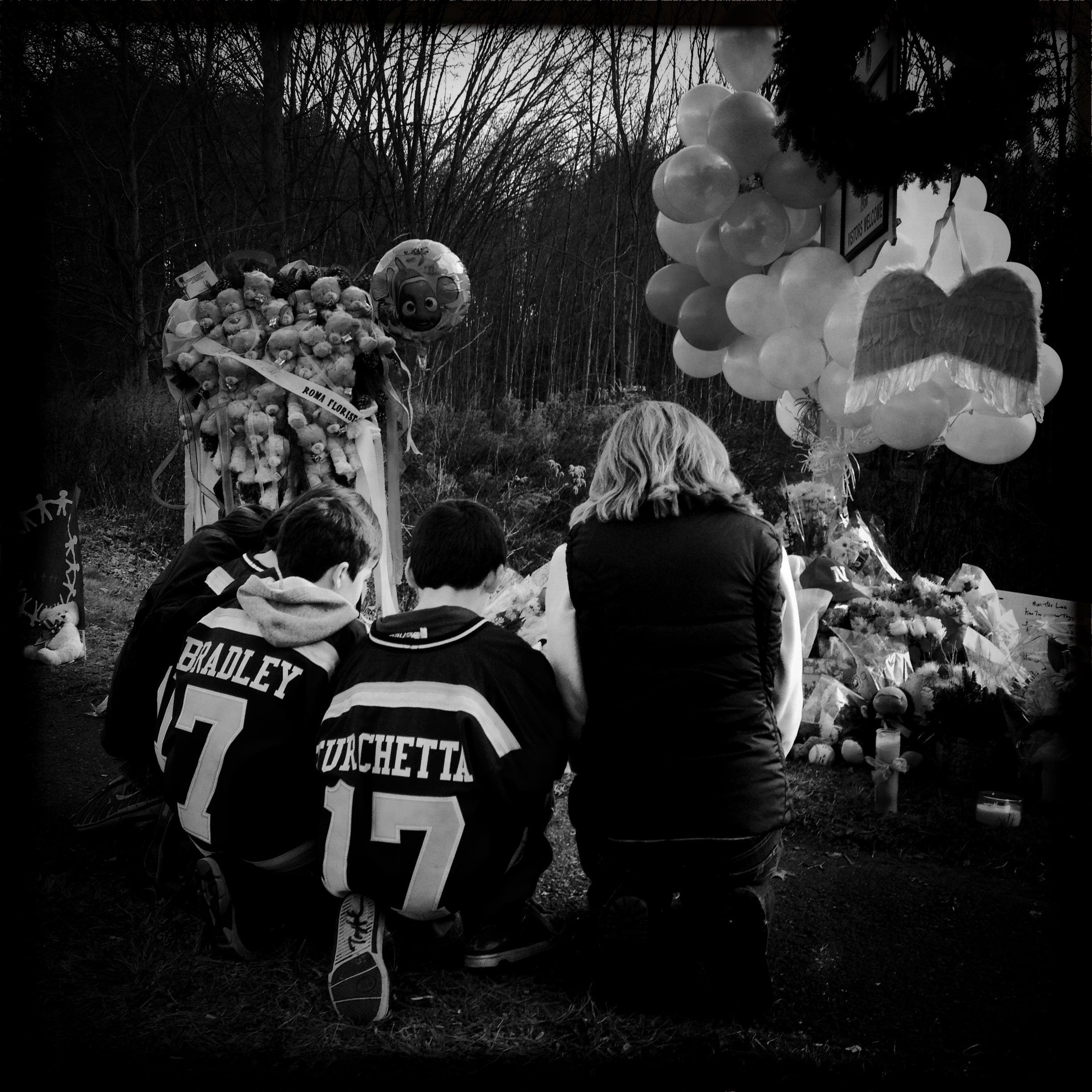 People pay their respects in Newtown, CT following the killing of numerous students and faculty at the local elementary school.
