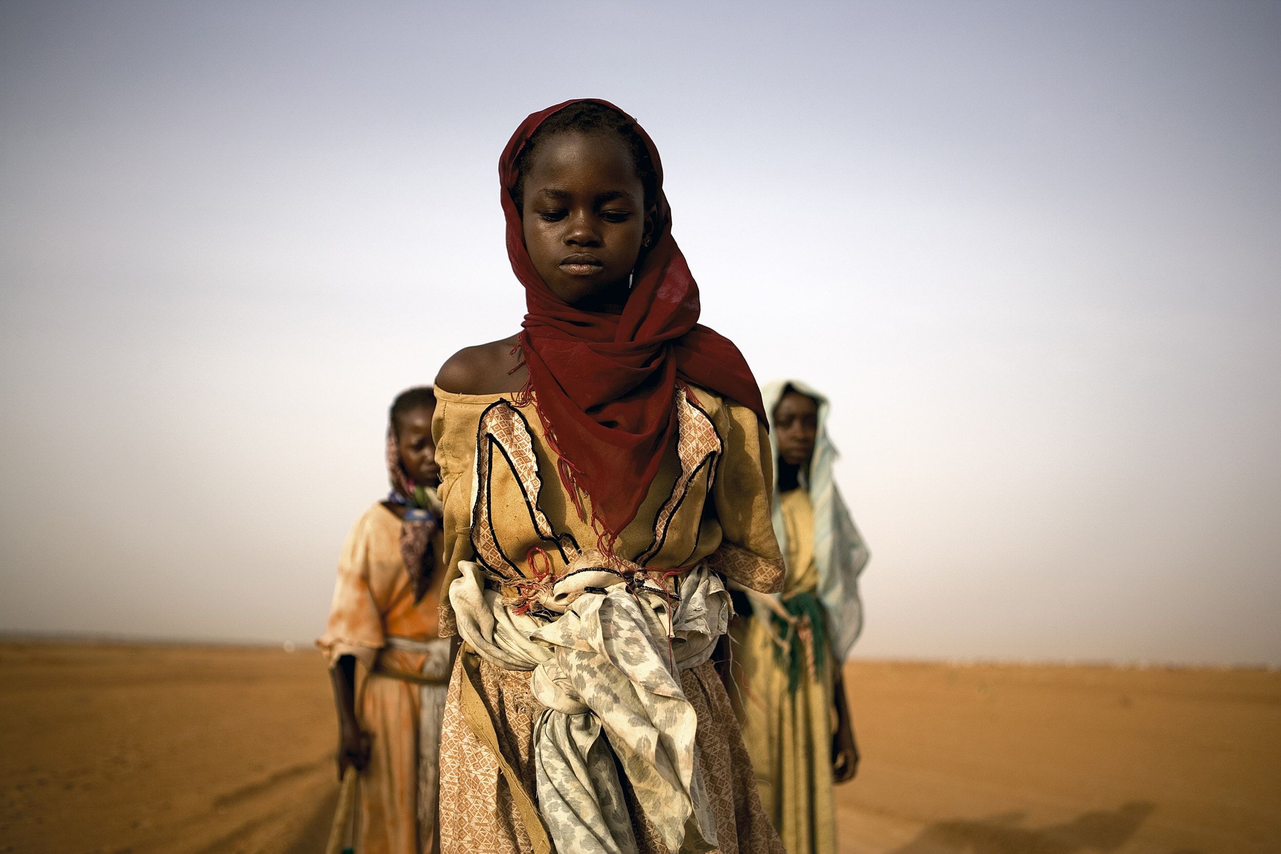 Displaced Darfuri girls looking for firewood.
