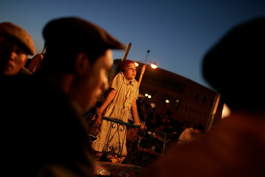 People shop and sell in the bazaars in Kashgar.   