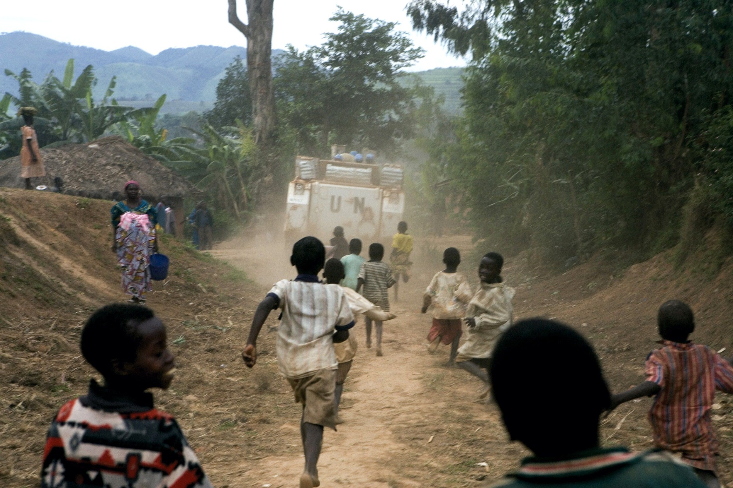 Children in the DR Congo follow a UN Peacekeeping Vehicle