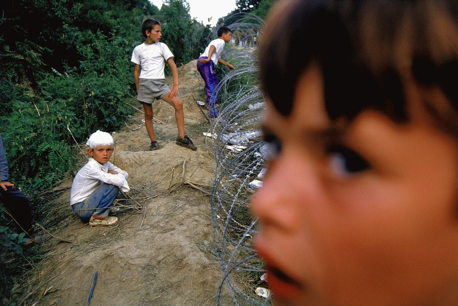 Children survivors of the attack on the United Nations Safe Haven in Srebrenica wait in a refugee camp in Tuzla, Bosnia.  © Ron Haviv - VII