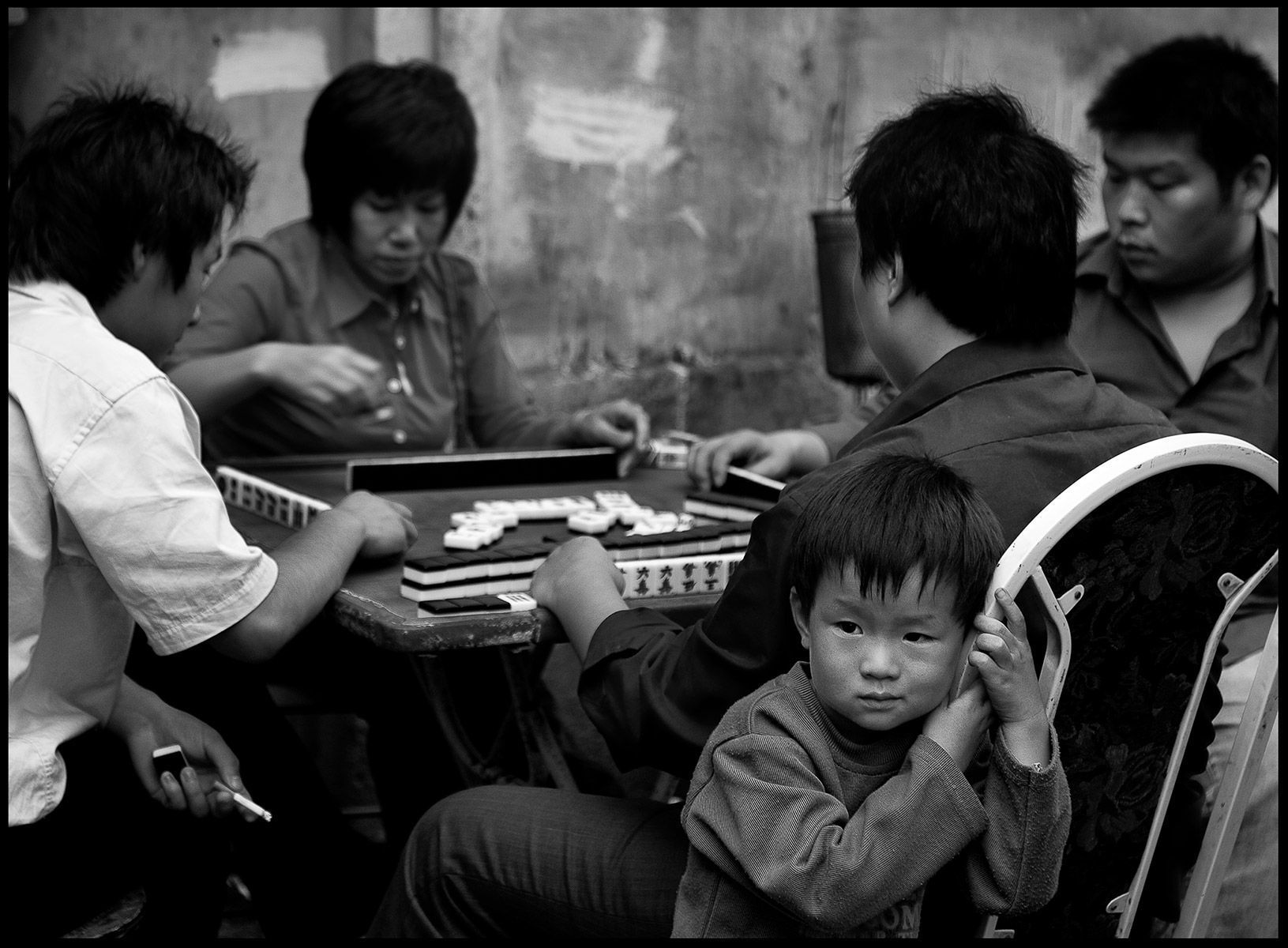 Child at Mah Jong game, Shanghai, 2008