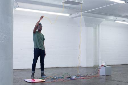 The Photographic Moment of Transition is an installation that illustrates the transition of a particular point in the history of photography. It’s a sculptural historical record showing how the technology that produced physical instant images from polaroid cameras transitioned into the technology that produces instant file based JPEGS on smartphones. It evaluates how people consumed instant images as physical polaroids to how people consume instant images as JPEG files on Instagram. New forms of technology replace old forms of technology and the medium of photography is apart of that evolutionary process. The Photographic Moment of Transition: Installation View