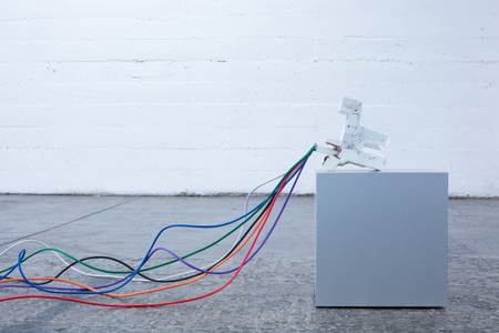 The Photographic Moment of Transition is an installation that illustrates the transition of a particular point in the history of photography. It’s a sculptural historical record showing how the technology that produced physical instant images from polaroid cameras transitioned into the technology that produces instant file based JPEGS on smartphones. It evaluates how people consumed instant images as physical polaroids to how people consume instant images as JPEG files on Instagram. New forms of technology replace old forms of technology and the medium of photography is apart of that evolutionary process. The Photographic Moment of Transition: Installation View