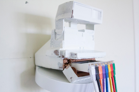 A work in progress installation about how the technology that produced physical instant images from polaroid cameras transitioned into the technology that produced data file based images that exist instantly on smartphones, the internet, and apps like instagram. The Photographic Moment of Transcendent Transition: installation View