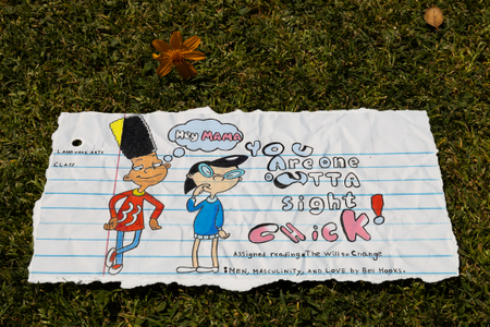 Fine art photograph of a torn language arts notebook page featuring hand-drawn Hey Arnold characters with the text "You Are One Outta Sight Chick!" and assigned reading "The Will to Change: Men, Masculinity, and Love by Bell Hooks," photographed on grass with a dried flower and acorn. From the My Middle School Notebook series by Los Angeles photographer Victor Koroma. Hey Arnold You Are One Outta Sight Chick — MY MIDDLE SCHOOL NOTEBOOK | Fine Art Photography | Victor Koroma