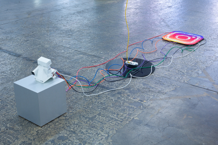 The Photographic Moment of Transition is an installation that illustrates the transition of a particular point in the history of photography. It’s a sculptural historical record showing how the technology that produced physical instant images from polaroid cameras transitioned into the technology that produces instant file based JPEGS on smartphones. It evaluates how people consumed instant images as physical polaroids to how people consume instant images as JPEG files on Instagram. New forms of technology replace old forms of technology and the medium of photography is apart of that evolutionary process. The Photographic Moment of Transition: Installation View