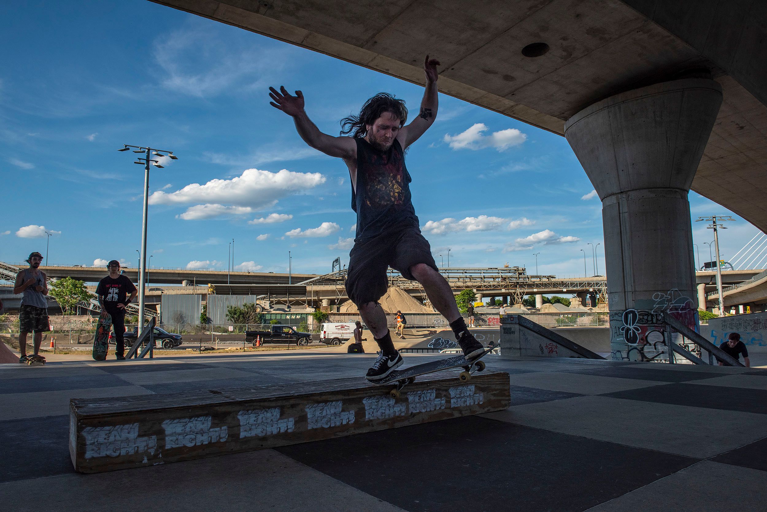 Color photograph of skateboarders working on their moves at the Lynch Family Skateboard Park, Cambridge, MA, Finding Balance