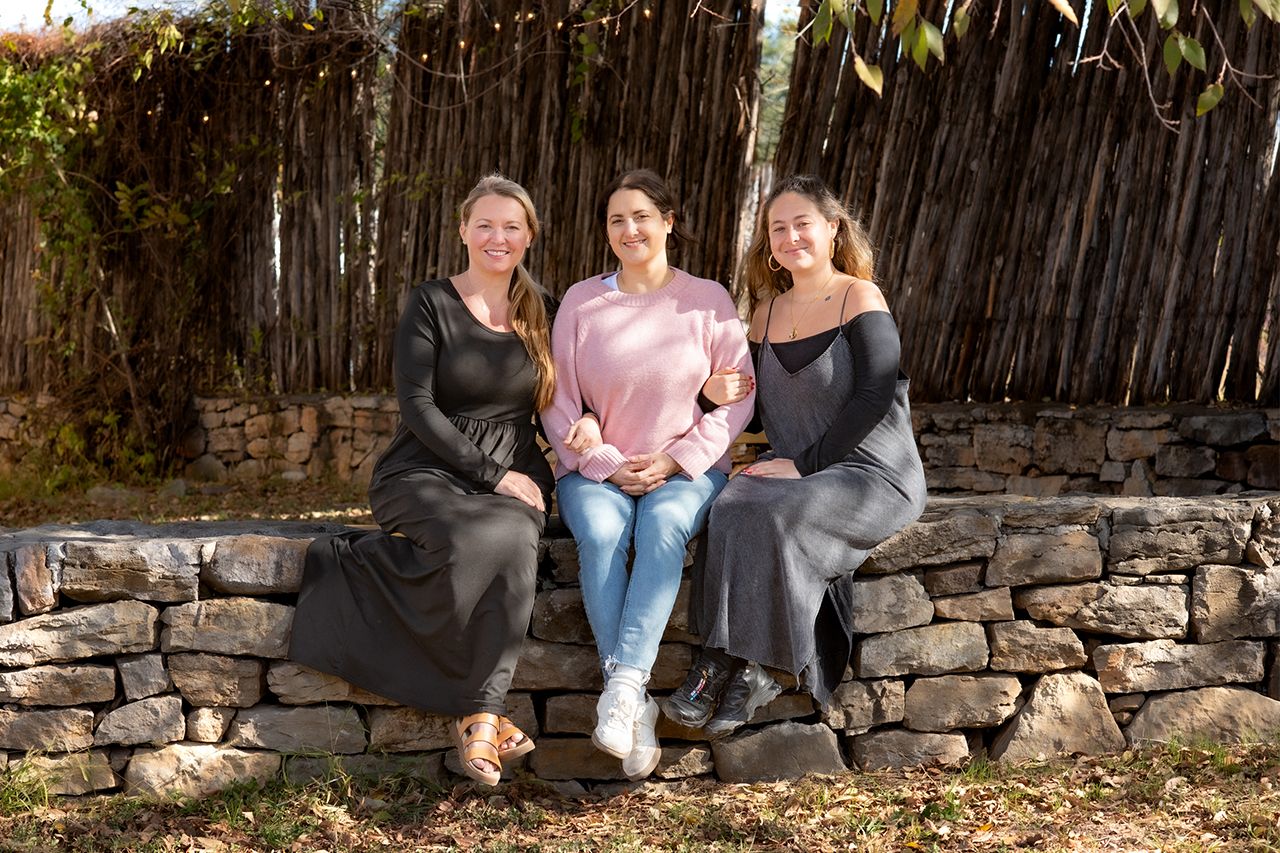 An outdoor portrait of three sisters