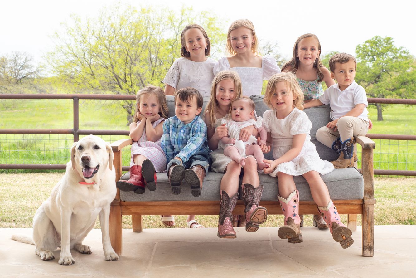 A portrait of children with their dog