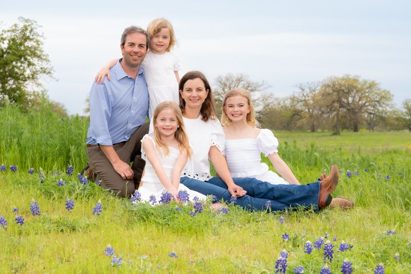 Outdoor portrait of a family in the bluebonnets