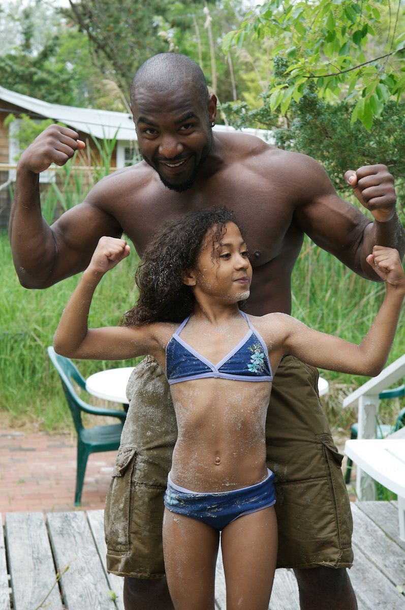 african american father and young daughter flexing their muscles pictures father and daughter pictures