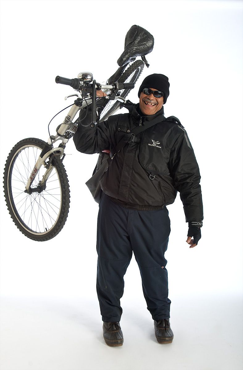 Bike messenger holdng up his bike on white background picture of bike messenger