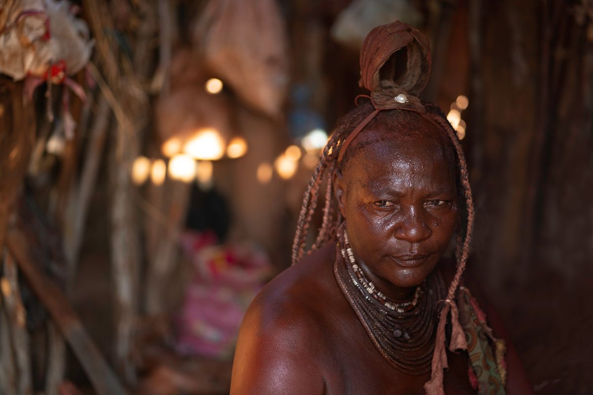 Hairstyles play a significant role within the Himba community and reflect marital status, age, wealth, and rank within the group. Himba Woman in her Hut