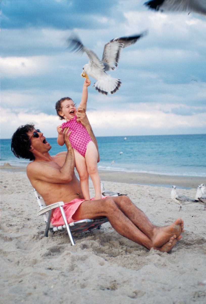 cute picture at the beach of a child feeding a seagull cute pictures at the beach