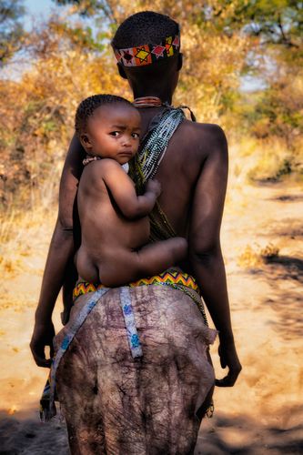 San Mama carrying her baby