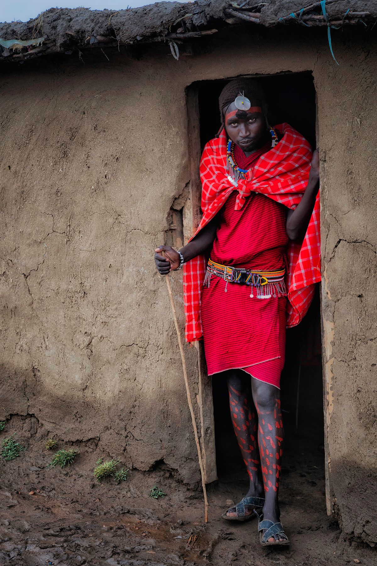 Masai man with painted legs