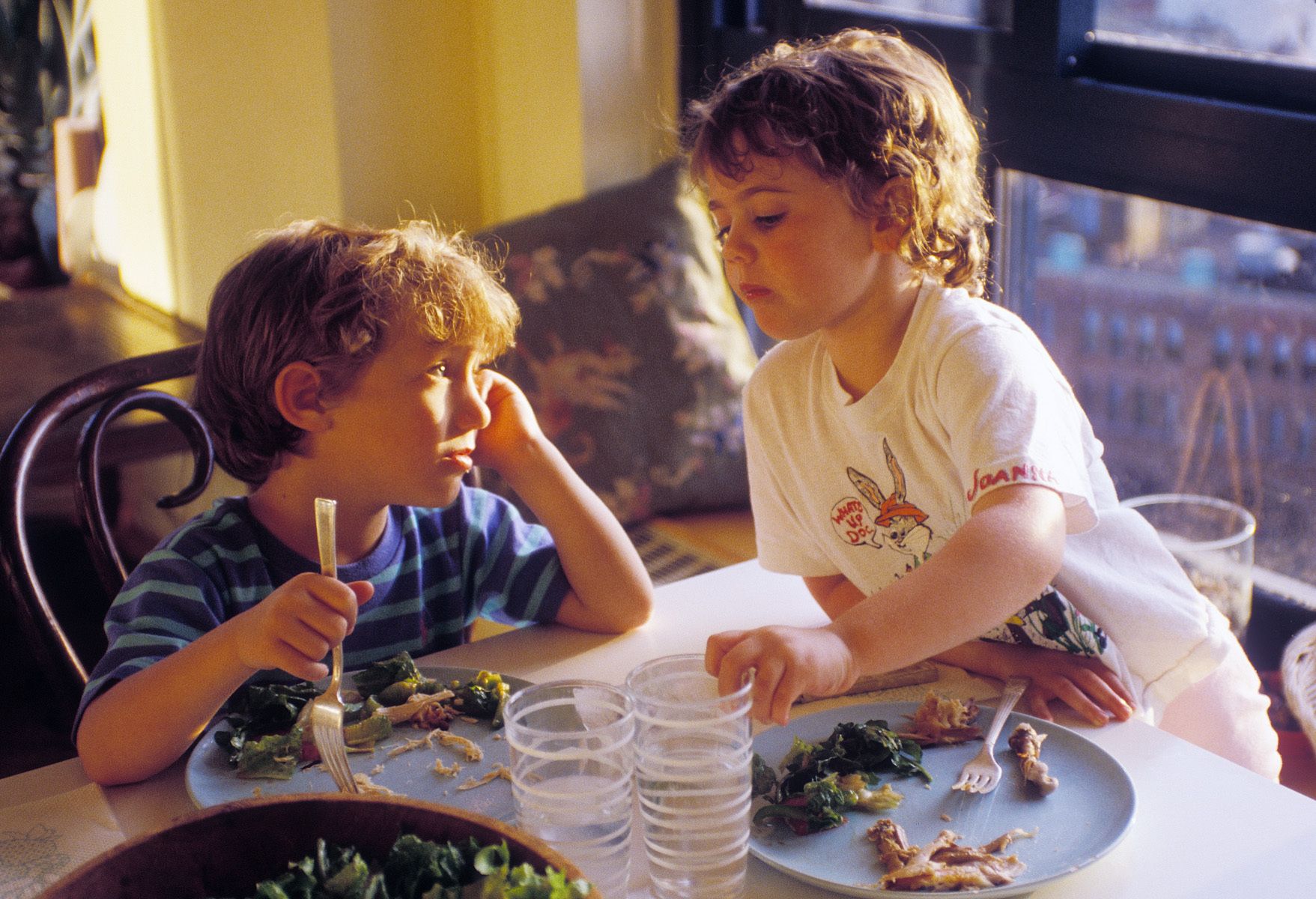 Kids photos.Two three year olds having lunch kids photos