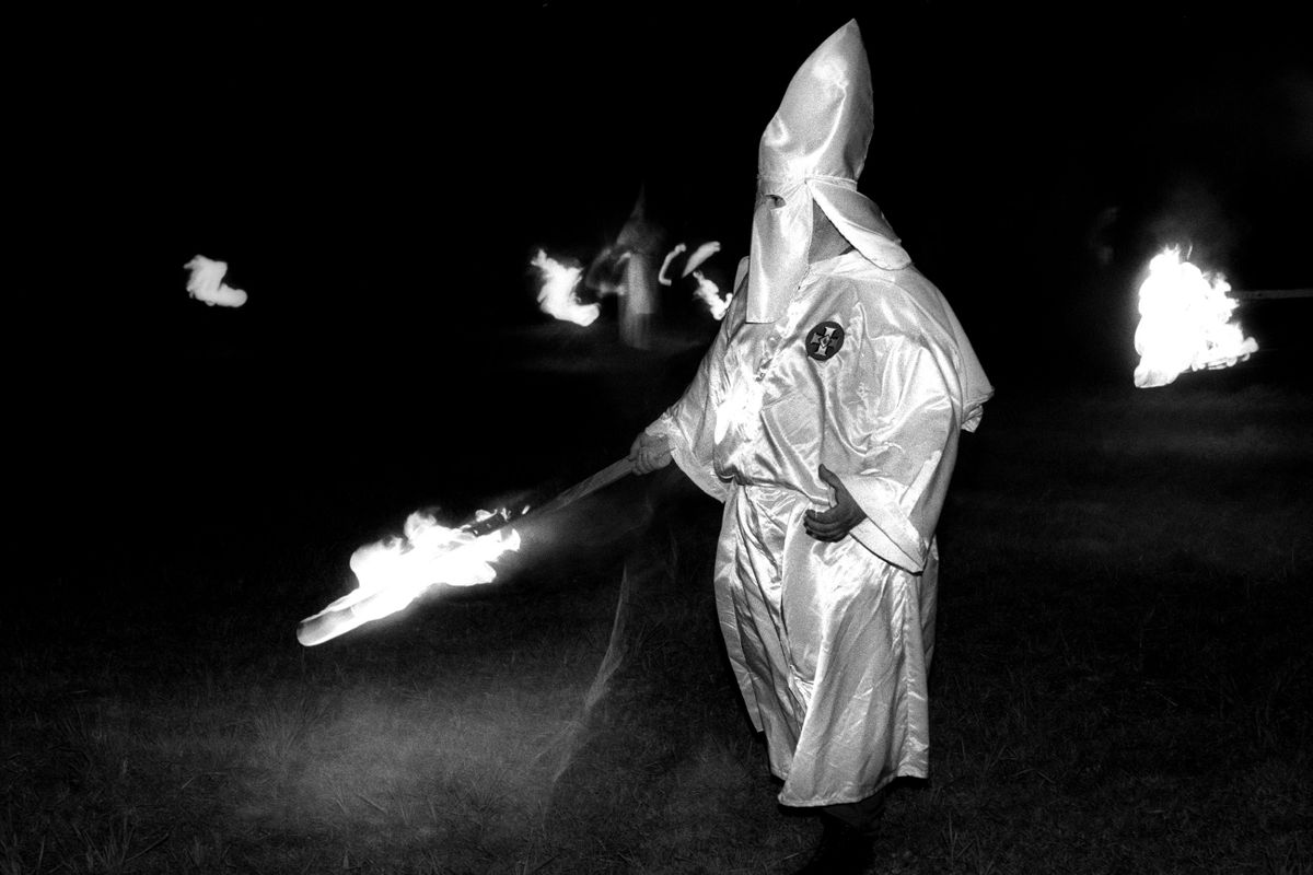 Aryan Nations Knights of the Ku Klux Klan cross lighting ceremony. Colt, Arkansas 2003