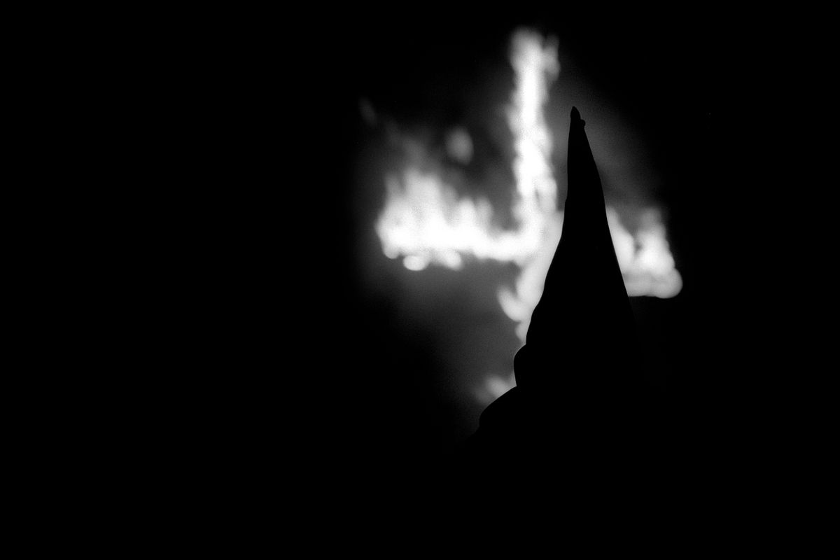 Aryan Nations Knights of the Ku Klux Klan cross lighting ceremony. Colt, Arkansas 2003