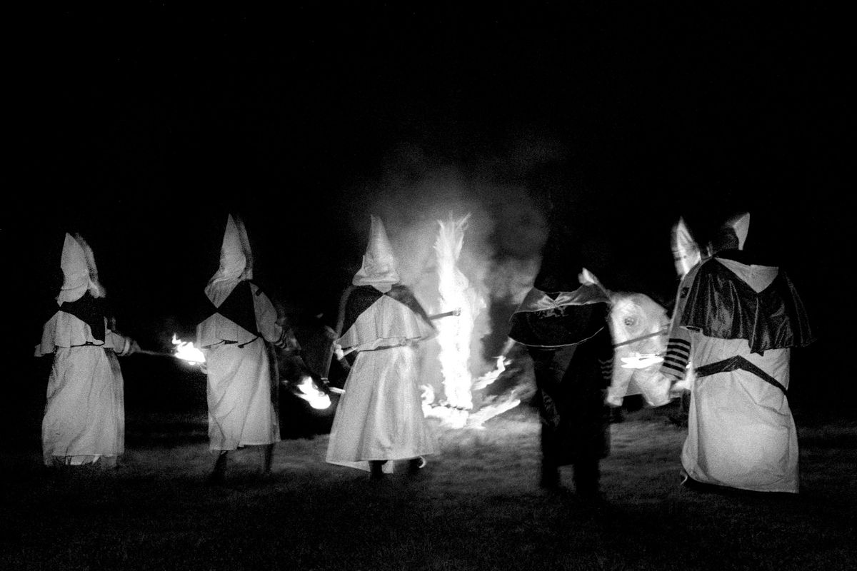 Aryan Nations Knights of the Ku Klux Klan cross lighting ceremony. Colt, Arkansas 2003