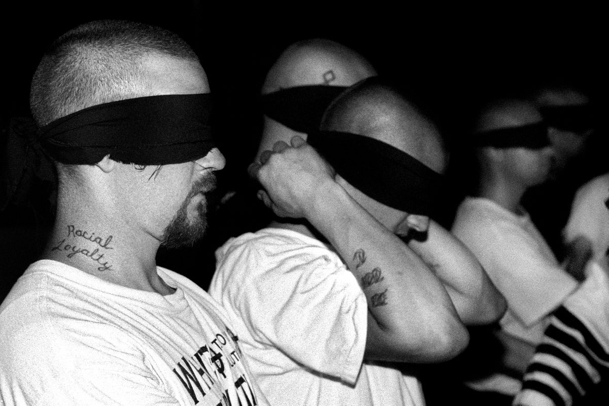 Aryan Nations Knights of the Ku Klux Klan initiation ceremony. Colt, Arkansas 2003