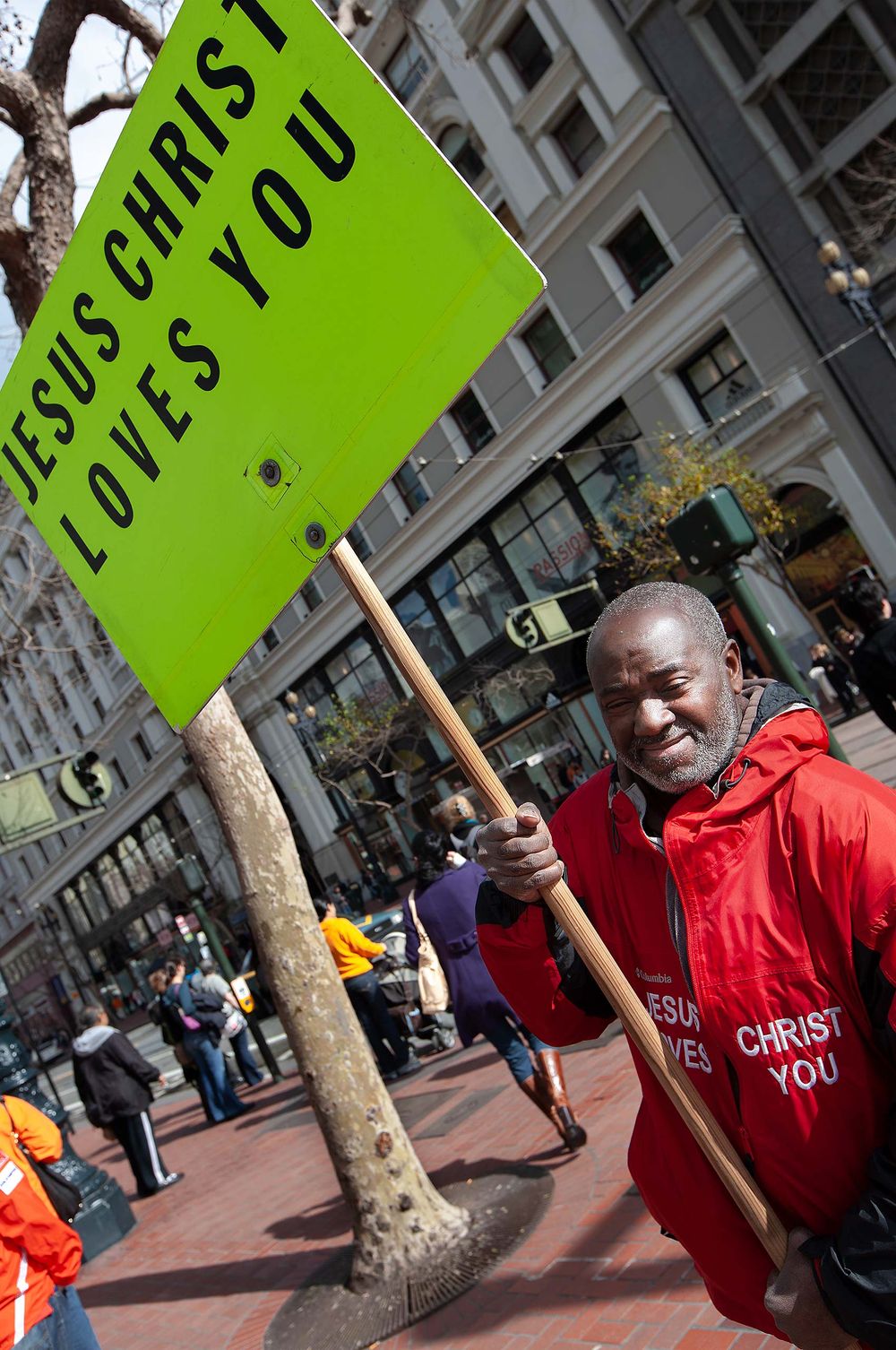 Jesus  christ loves you . This guy stood there for years on Market street in san francisco California