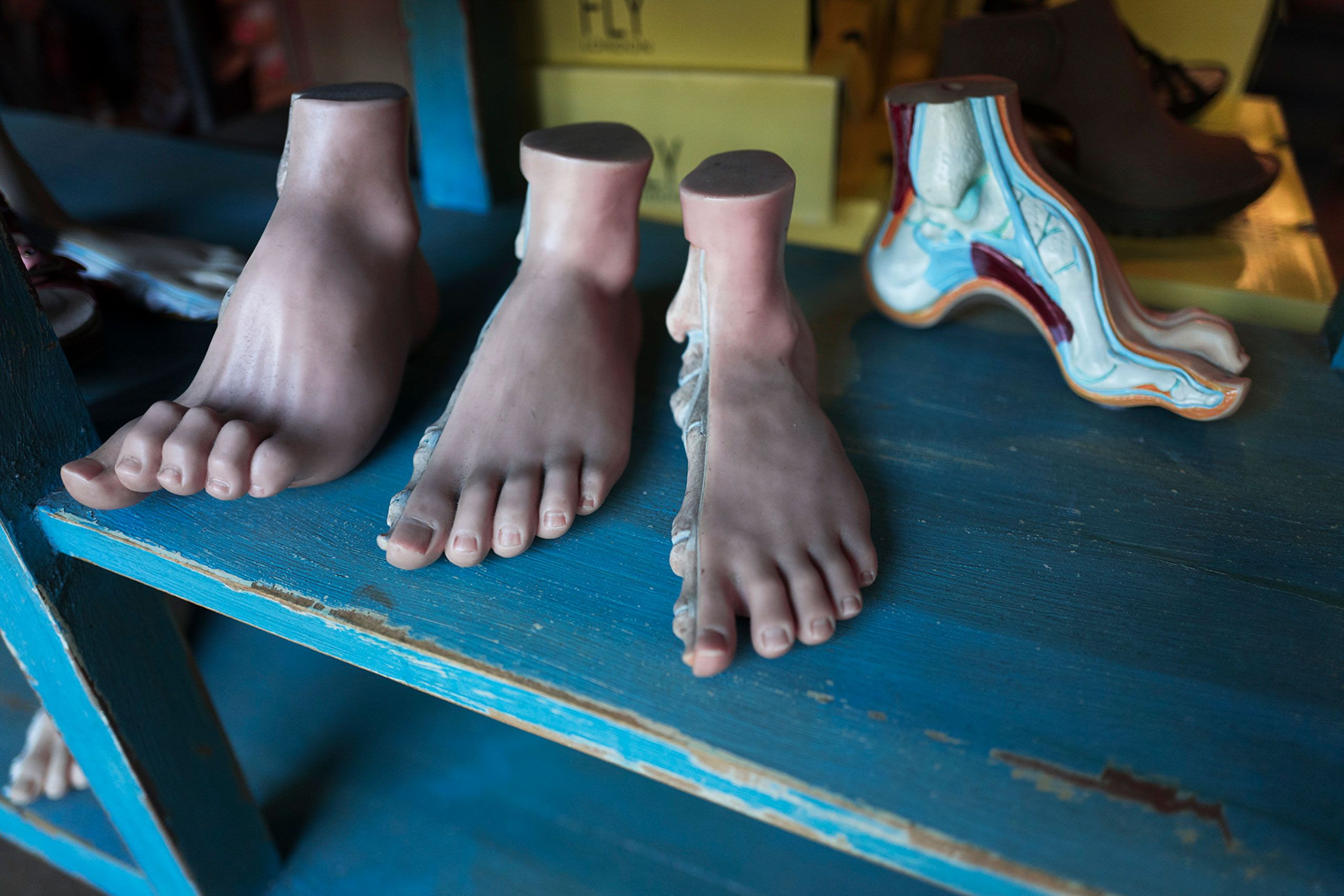 plastic feet at a shoe store  in window  New Orleans 