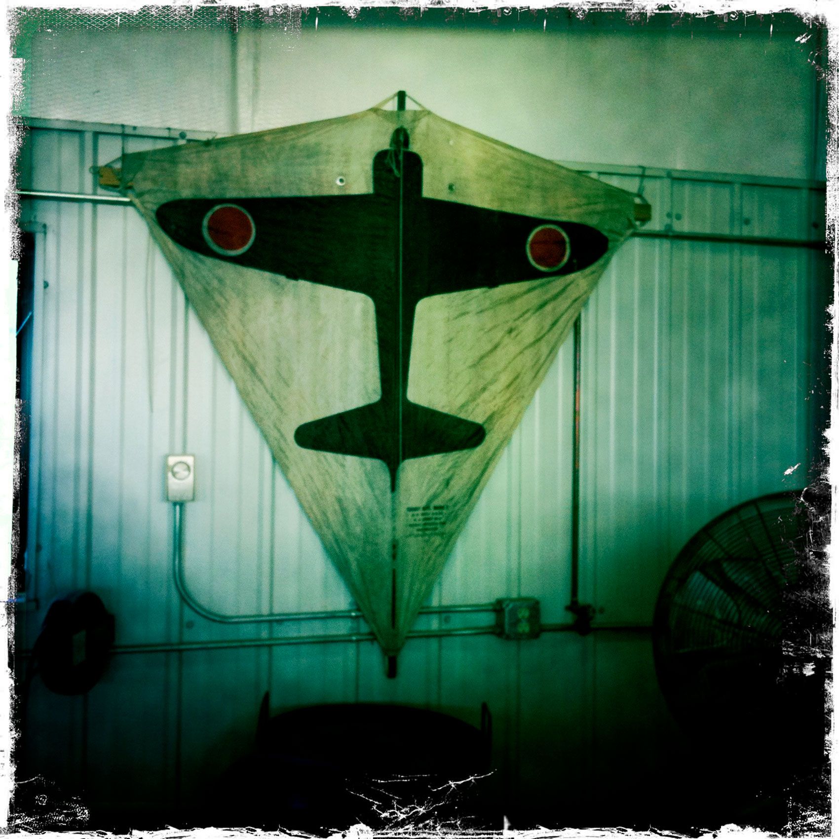 Jasaneese Zero airplane Airplane Kite on wall Boulder Colorado 