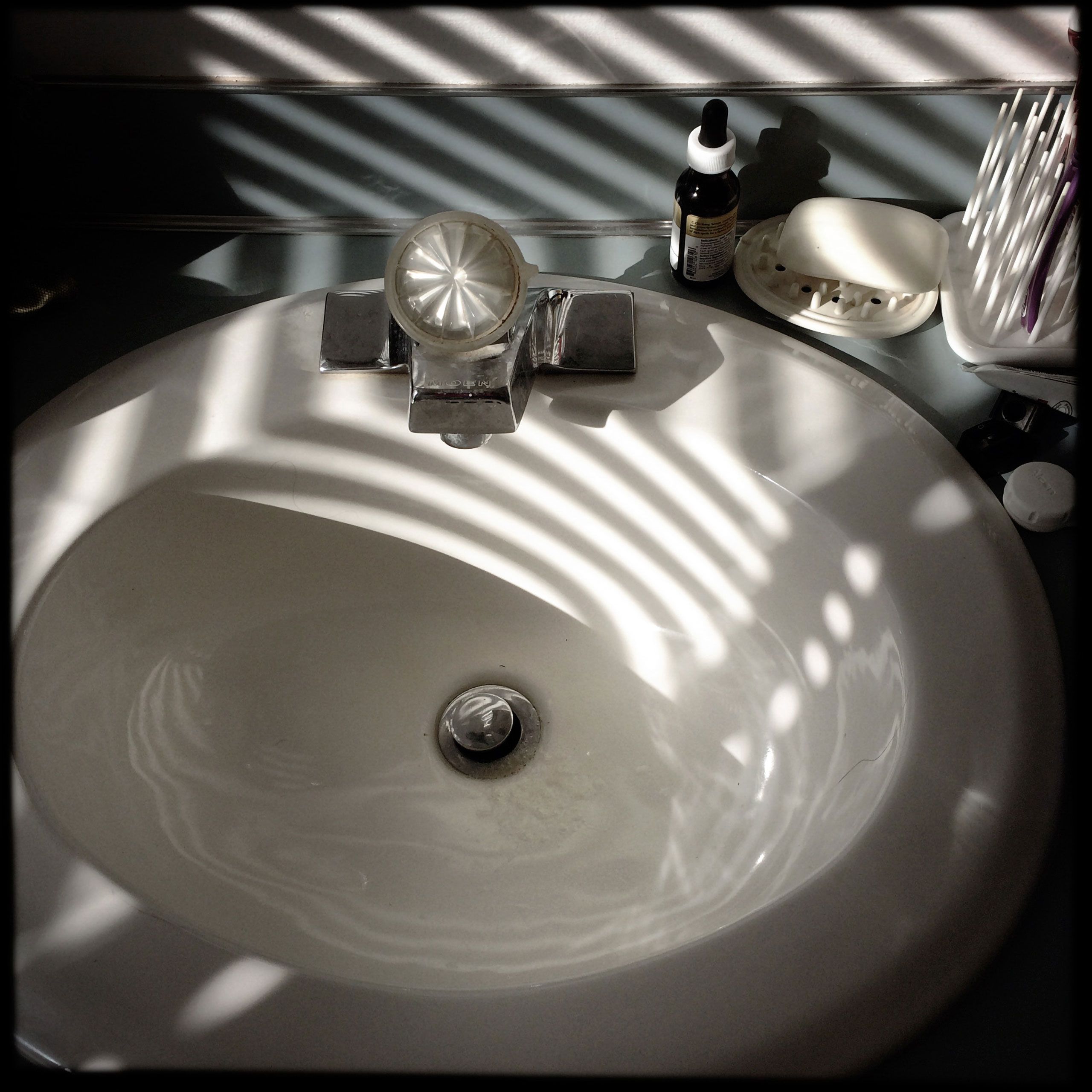 Bathroom sink and counter in striped light Scarbrough Maine