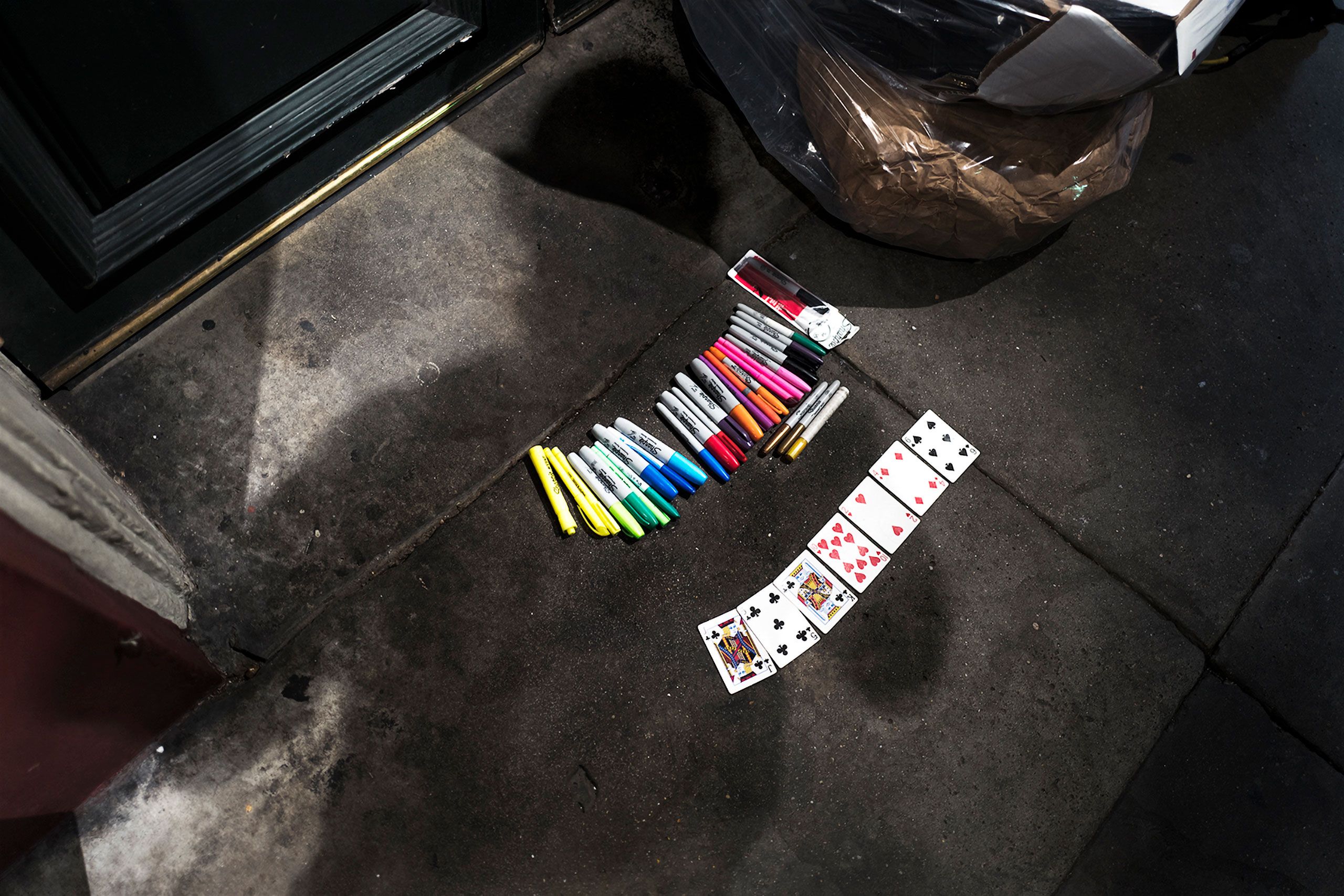 cards and pens on sidewalk in french quarter in New Orleans 