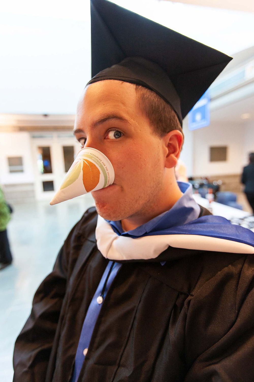 Happy Brandeis University graduate Sam Roos drink water as only a smart ass can Waltham Massachusetts