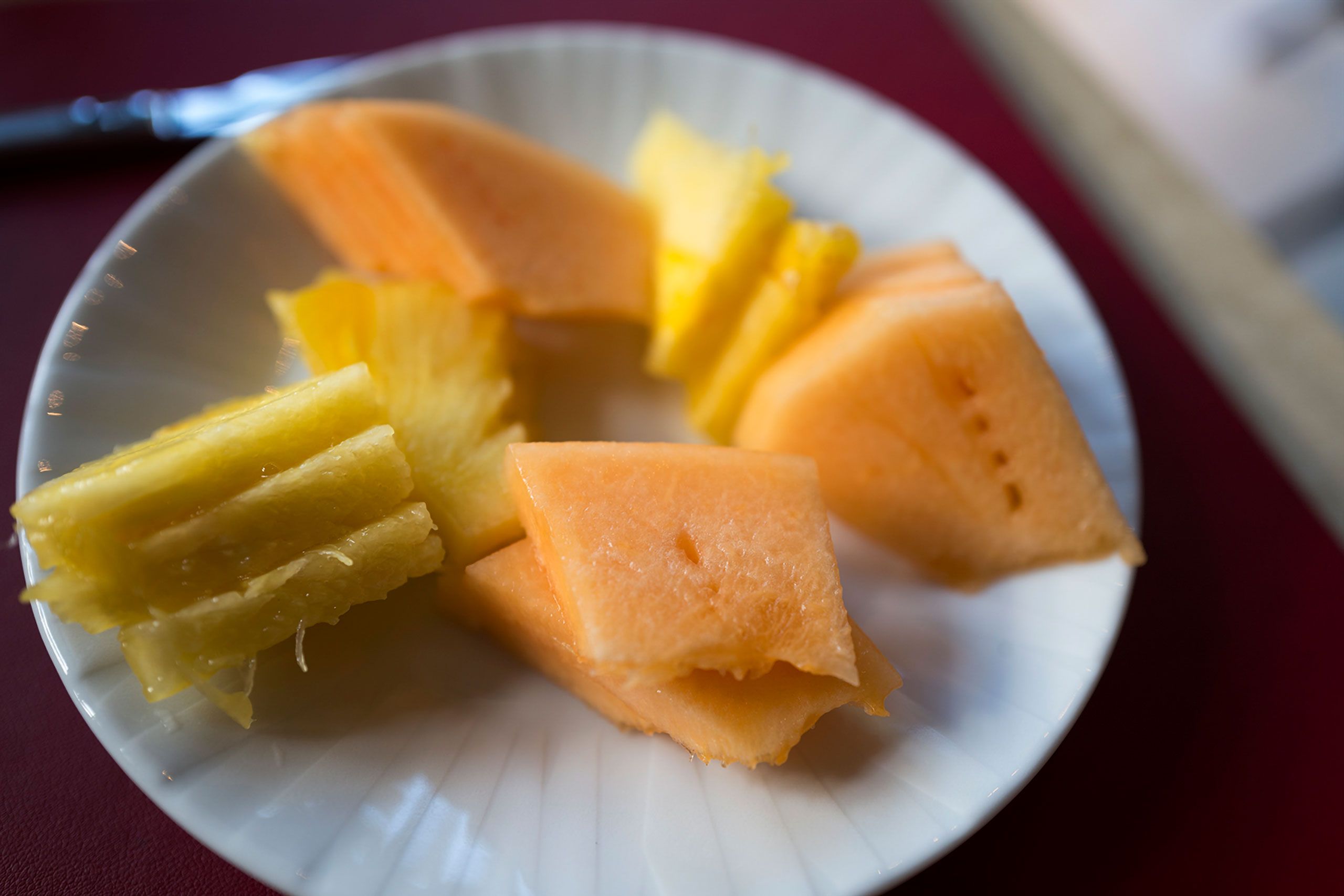 sliced pineapple and cantaloupe snack breakfast 