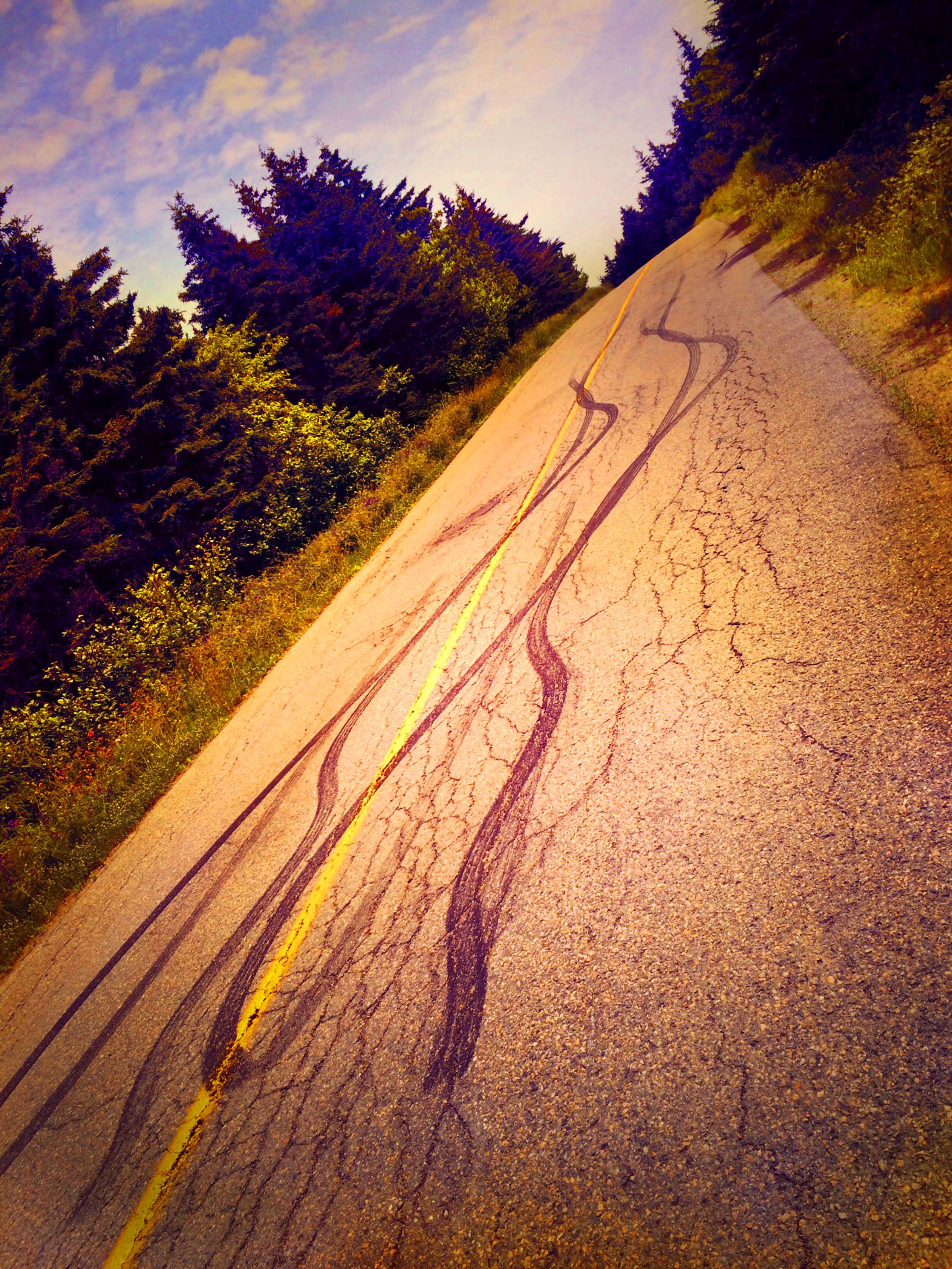 SKID marks on mountain road Magdalen Islands Îles de la Madeleine Quebec Canada  