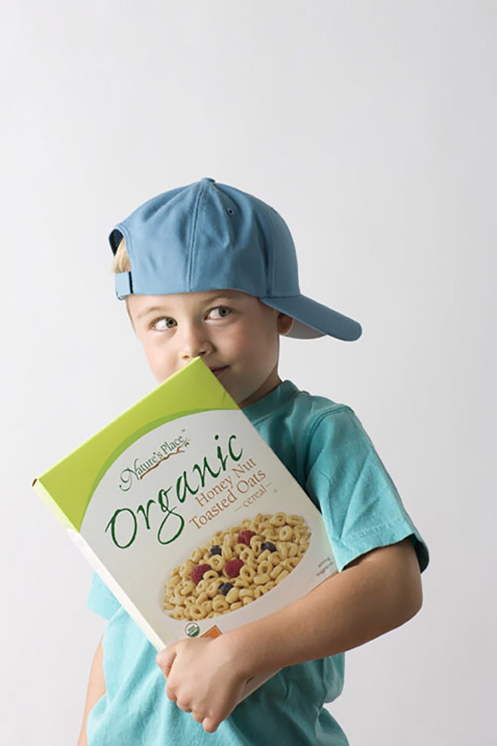 Shy Boy with organic cereal model studio  adverting photography