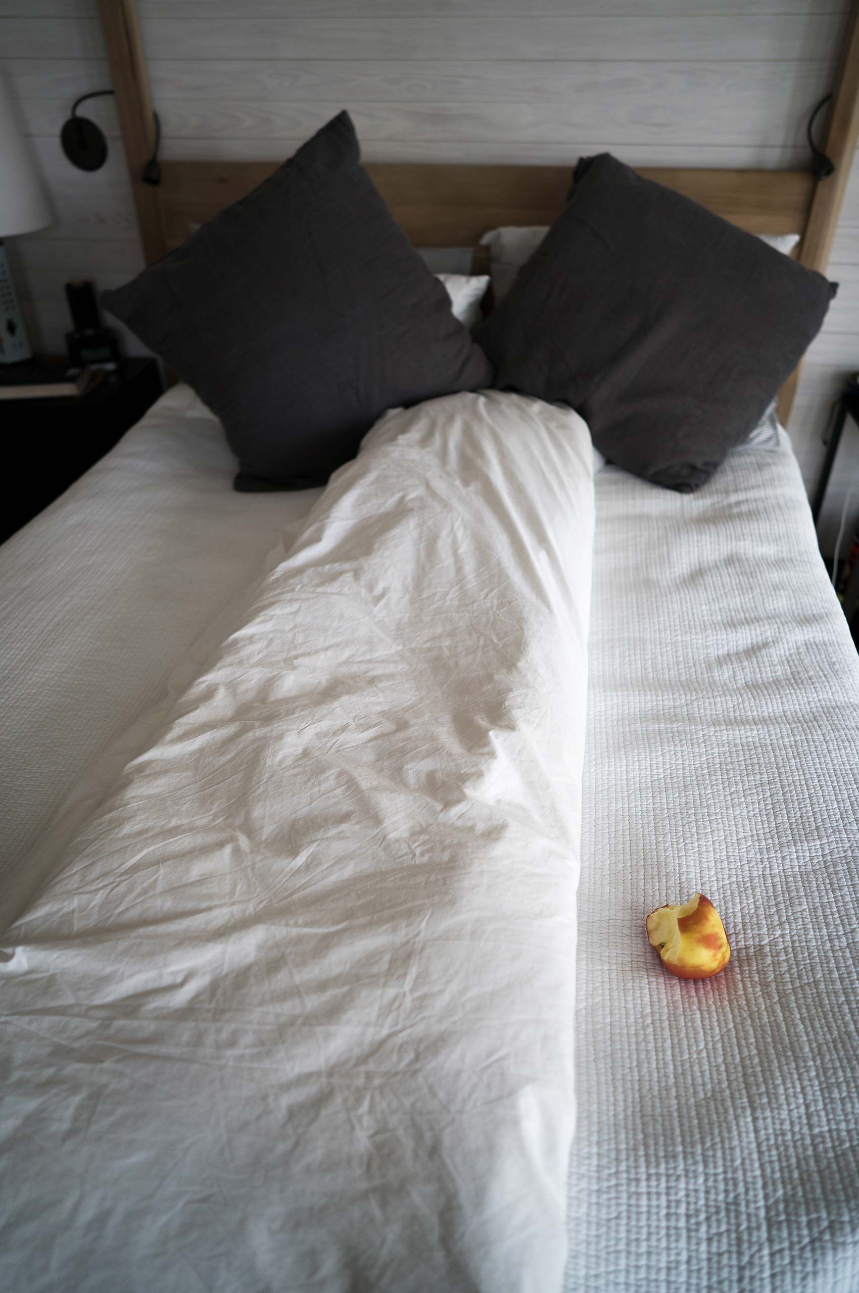 bed in bed room half eaten peach megaphone 