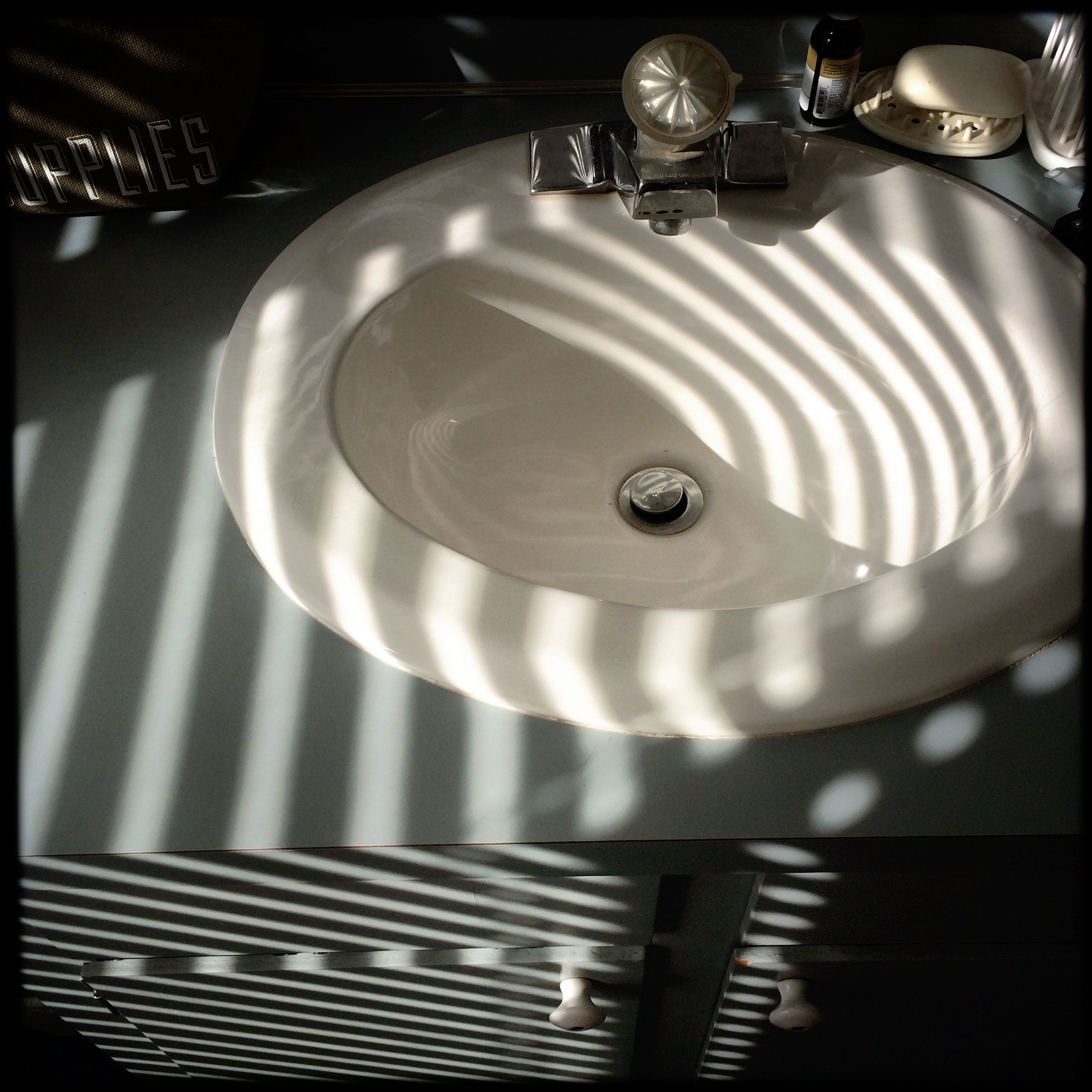 Bathroom sink and counter in striped light Scarbrough Maine