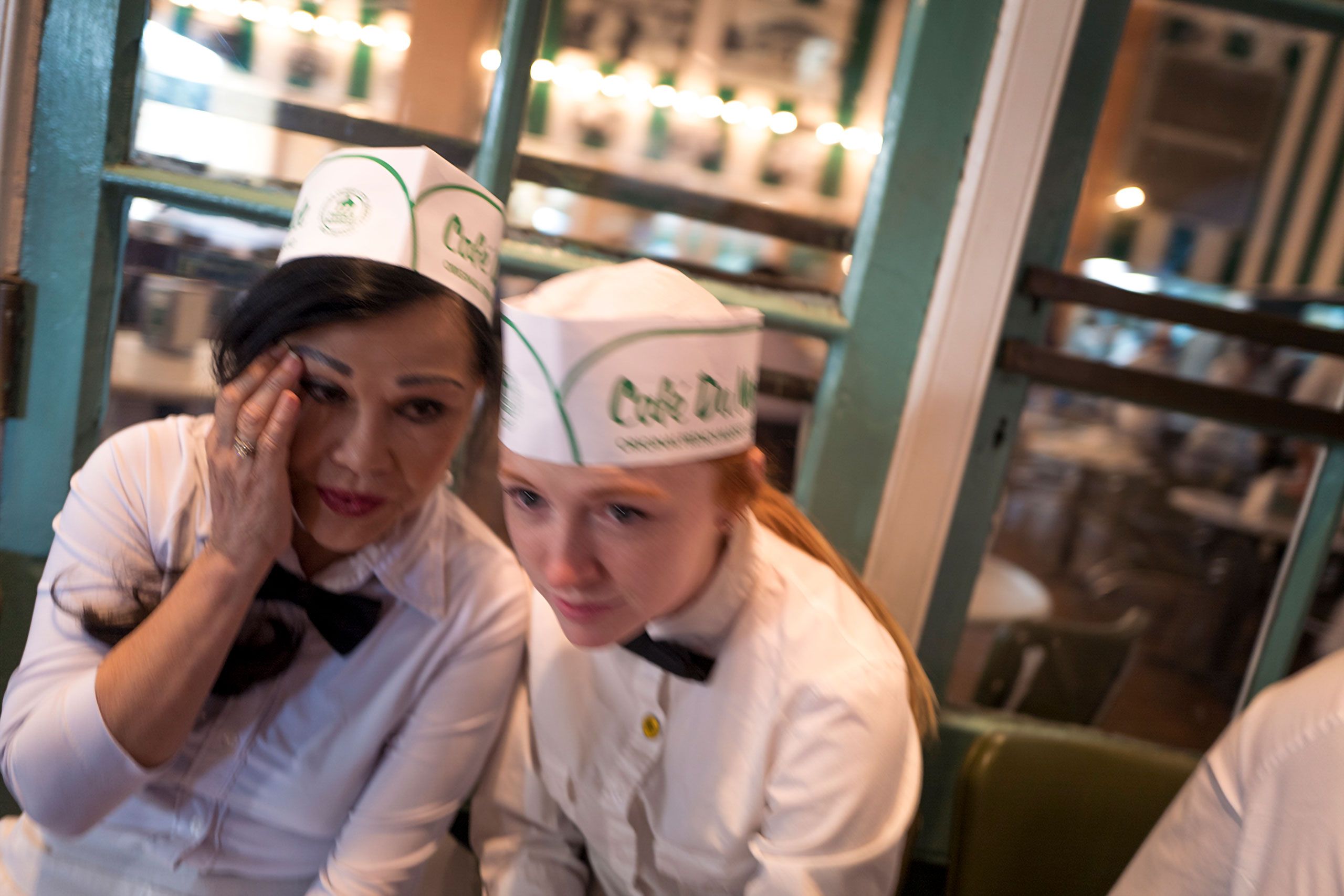 woman waters whispering secrets Cafe Du Monde French Market NOLA new orleans