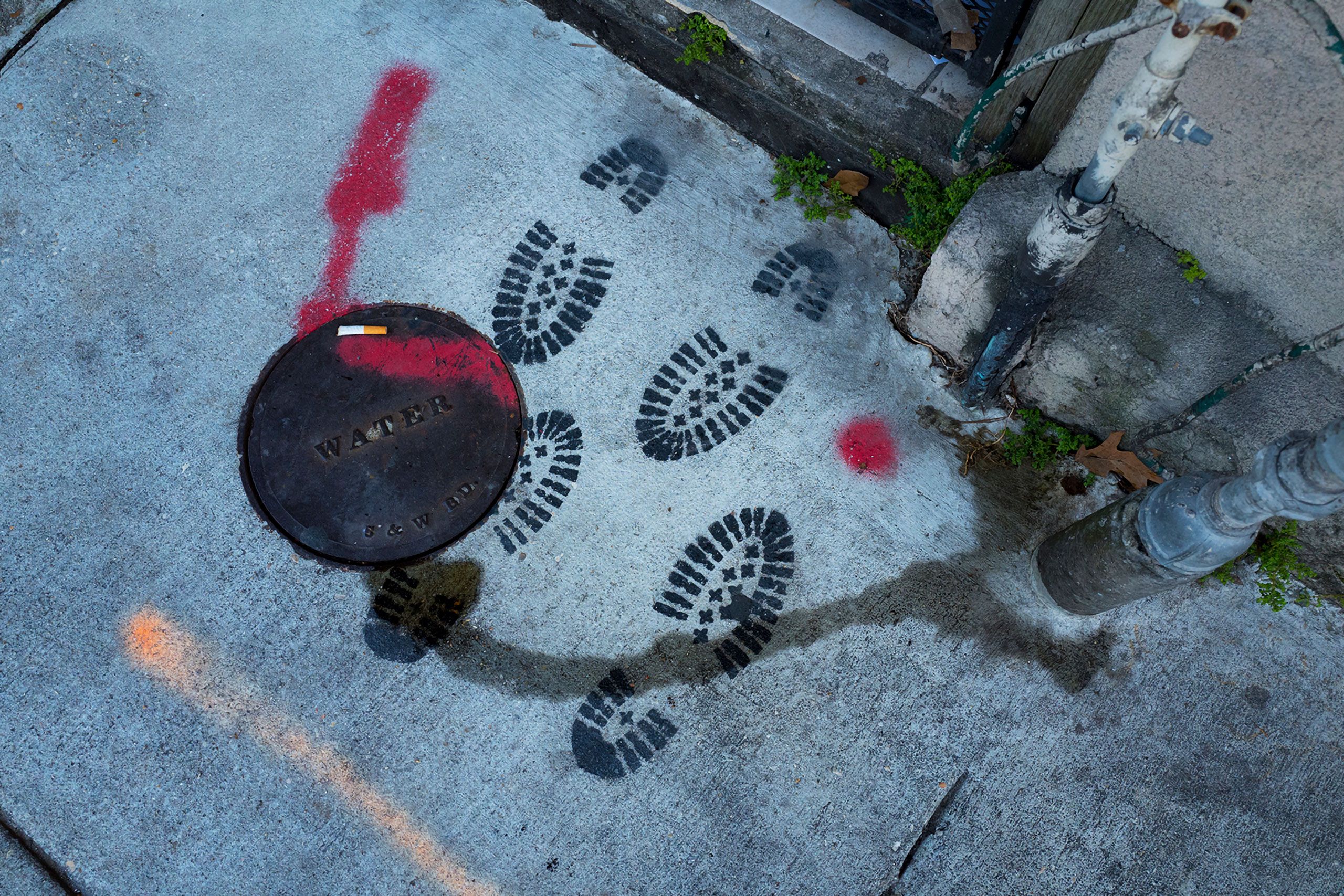Footprints bootprints of sidewalk;k in NOLA