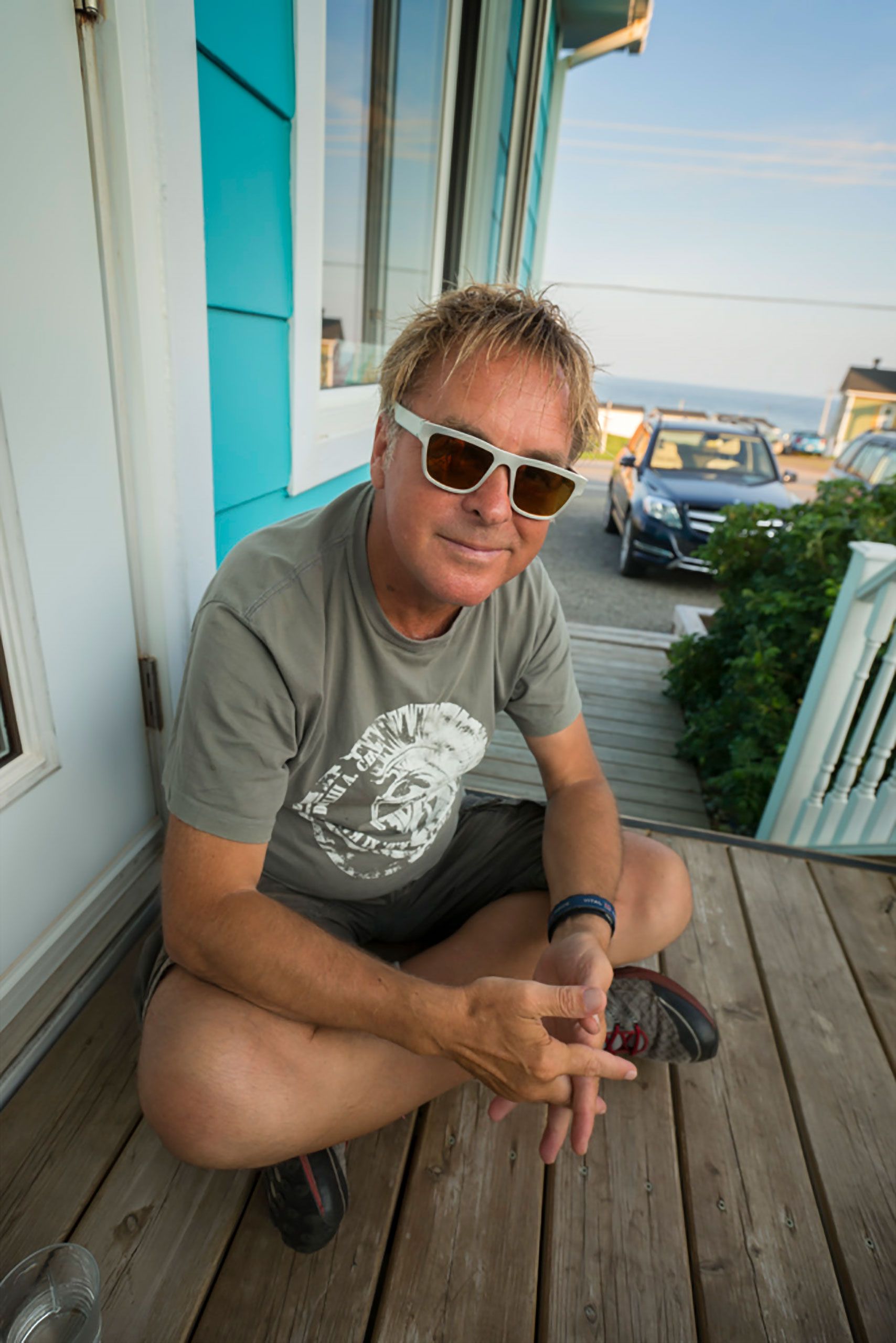 lucien hanging on porch in Magdalen Islands Îles de la Madeleine Quebec Canada  Harve Aubert